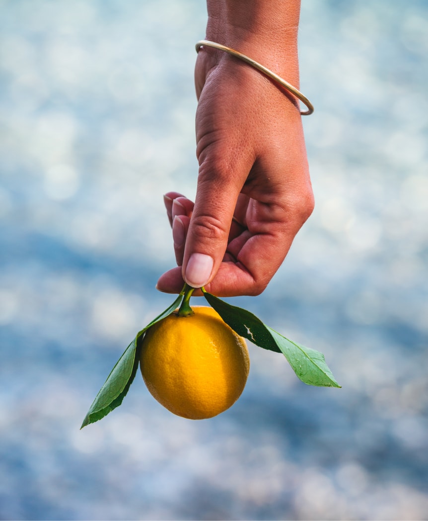 hand holding lemon
